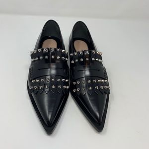 Alexander McQueen punk fringe moccasin flats.